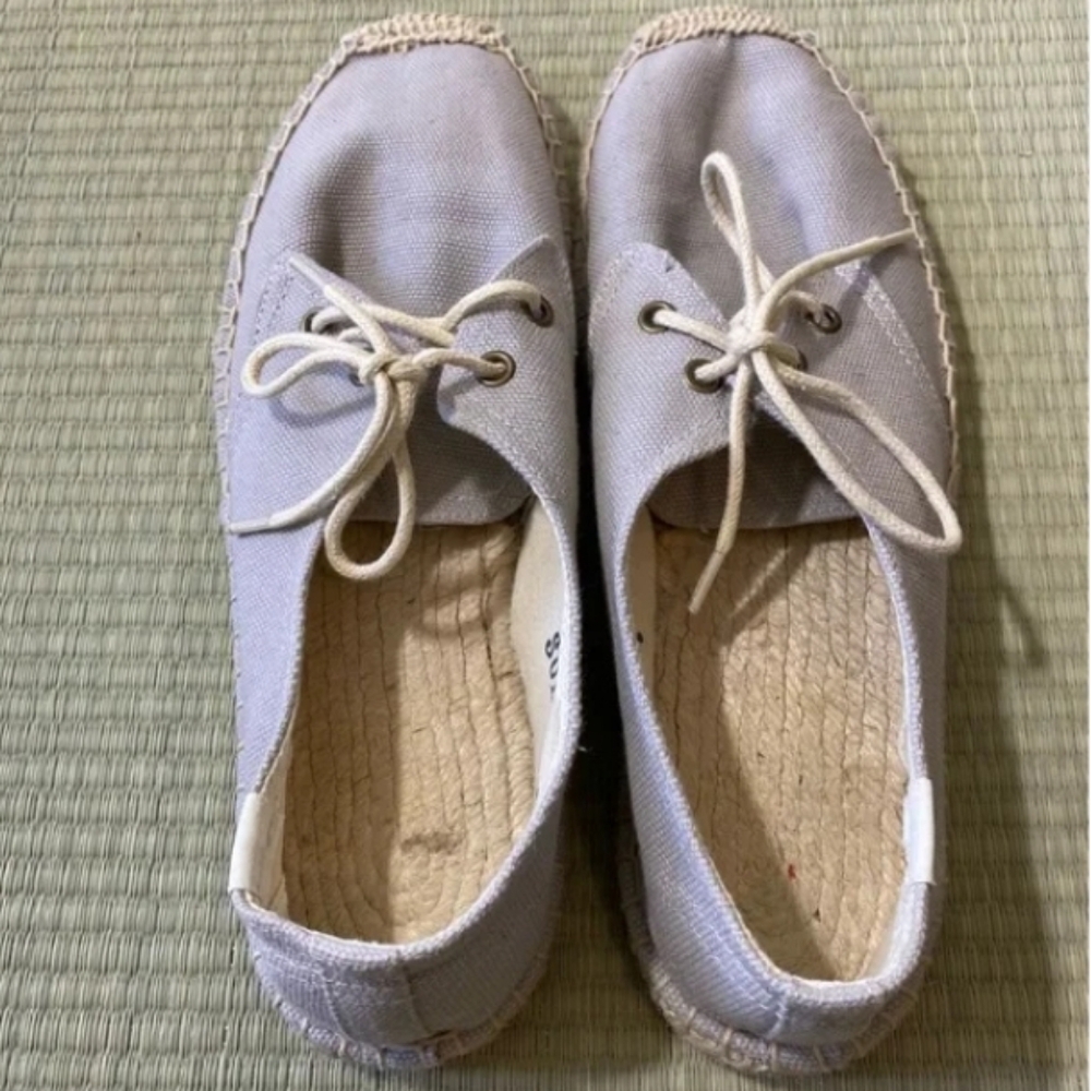 Women lace up linen shoes